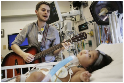 Music Therapist treating a kid by singing